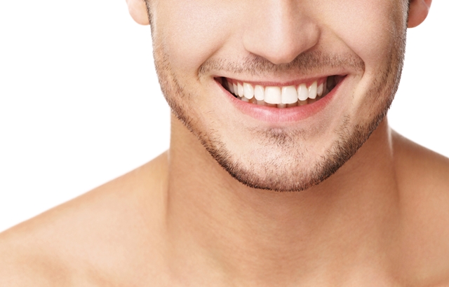 A close up of a young man smiling