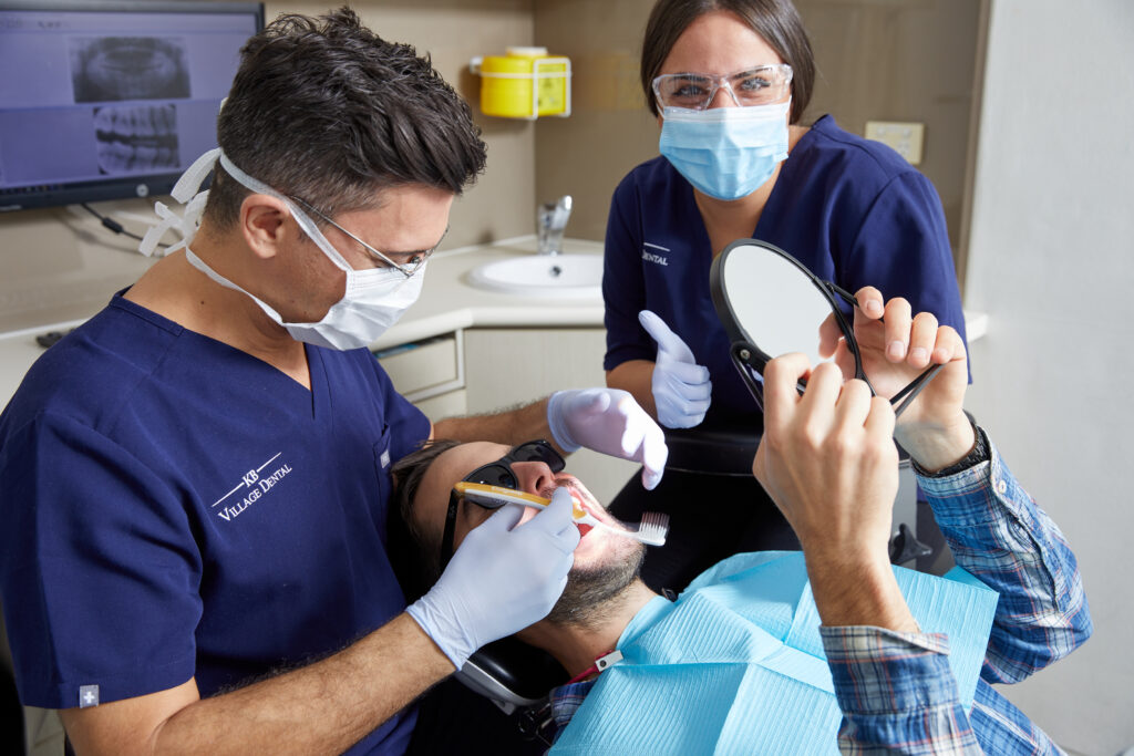 Dentist performing a dental exam on a patient