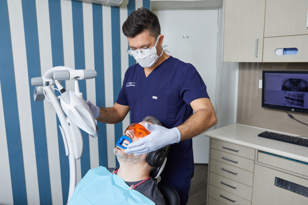 a patient undergoing teeth whitening treatment