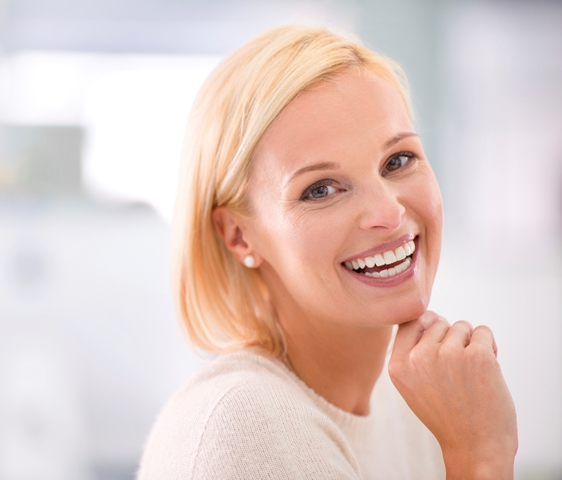 Blond woman smiling with veneers