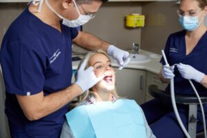 Dentist checking patient's teeth for cavities