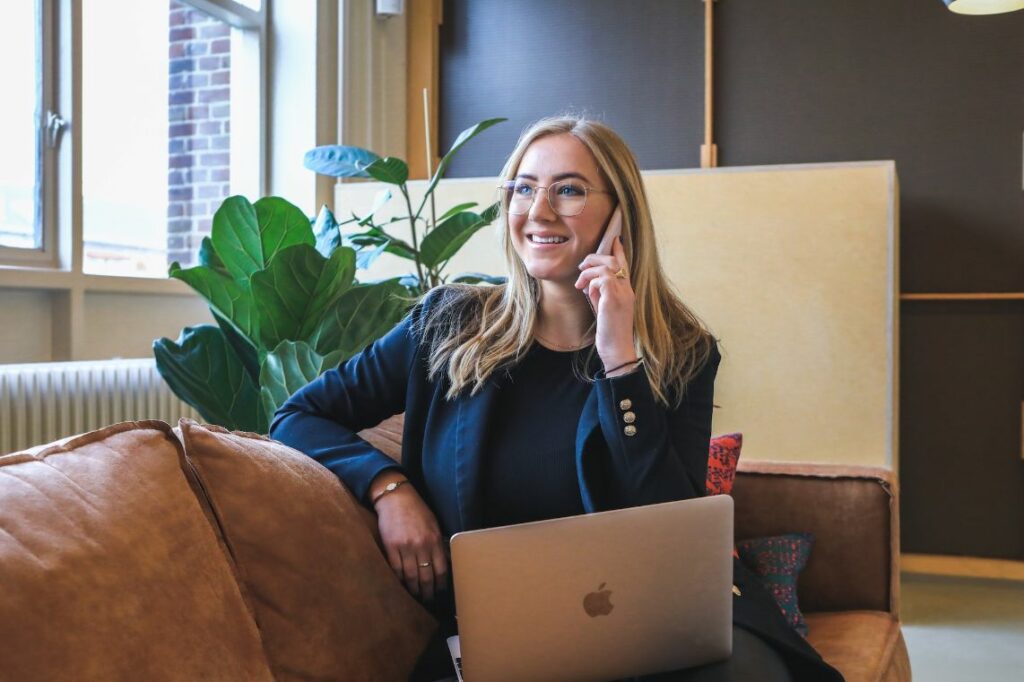 Smiling woman calling on cell phone