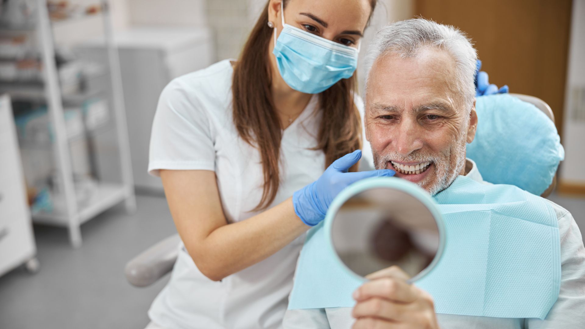 older man receiving dental implants